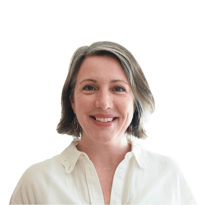Smiling woman with short hair in white shirt